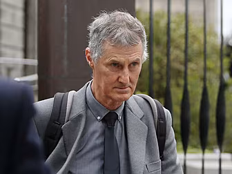 Former Archbishop settles defa...