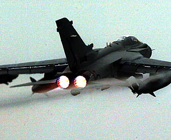 British MPs debate airstrikes...