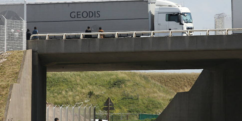 Migrants break through fences...