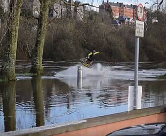 Man Wakeboards The Floods In C...