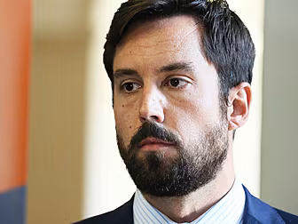 Housing Minister Survives Vote...