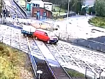 WATCH: Van Crashes Through Tra...