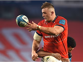 Munster's Gavin Coombes signs...