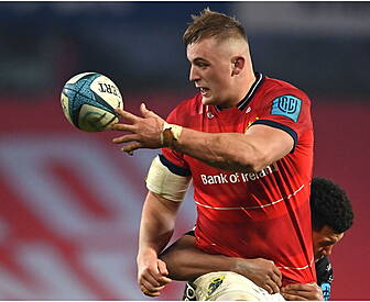 Munster's Gavin Coombes signs...